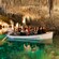 Passengers on a row boat inside of a cave